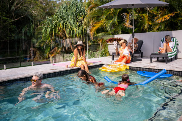 istock Children and adults enjoying weekend pool party 2190233709