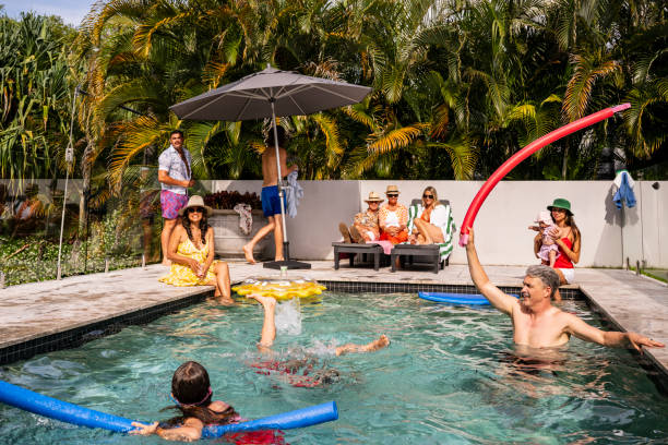 istock Adults and children having fun at Byron Bay pool party 2190233721