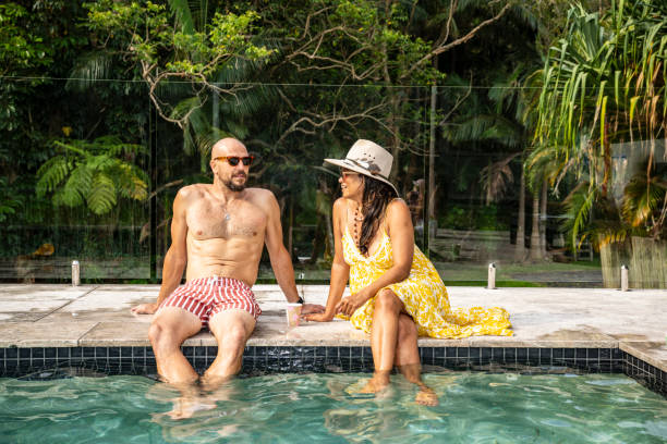 istock Friends relaxing and talking at Byron Bay backyard party 2190233748