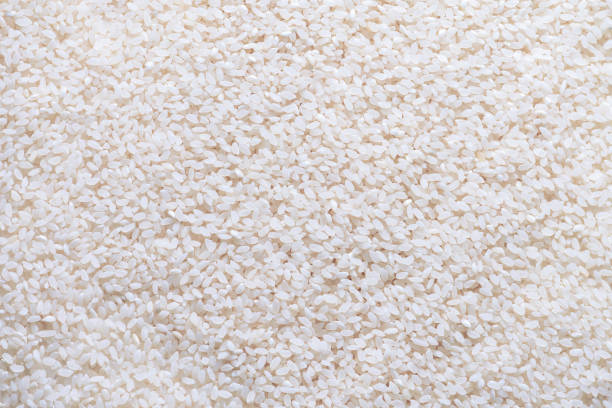 istock The background is made of white round grain rice. 2190233868