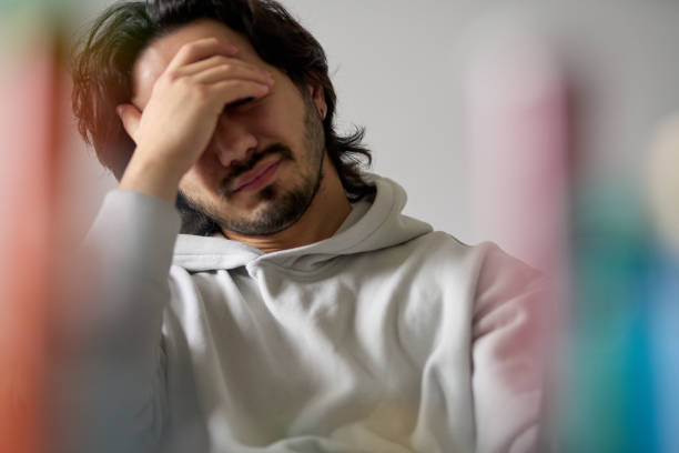 istock Sad man with hand on face suffering from depression and anxiety 2190235069