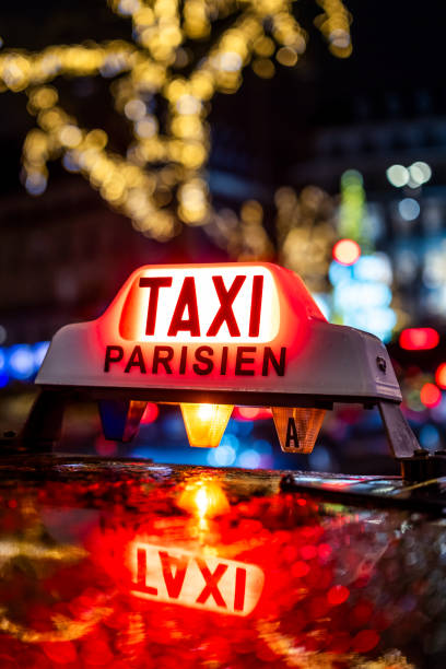 Parisian Taxi Sign Illuminated at Night