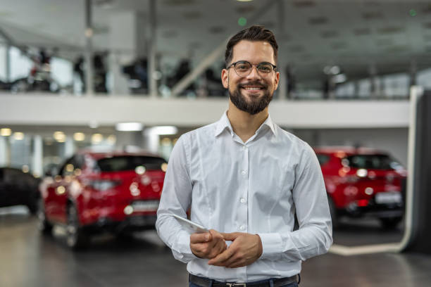 istock Professional advisor in a modern car showroom 2190241598