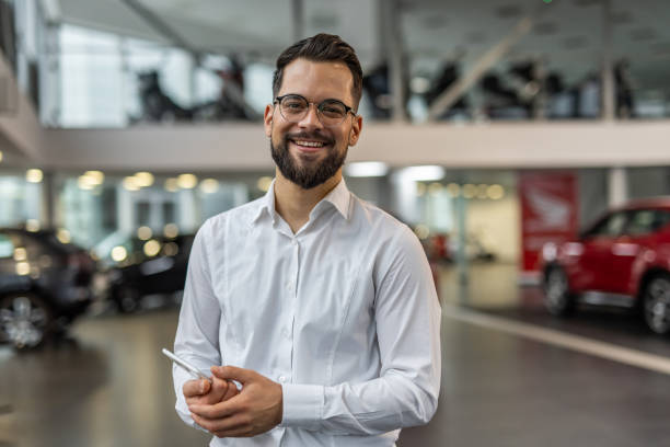 istock Professional advisor in a modern car showroom 2190241603