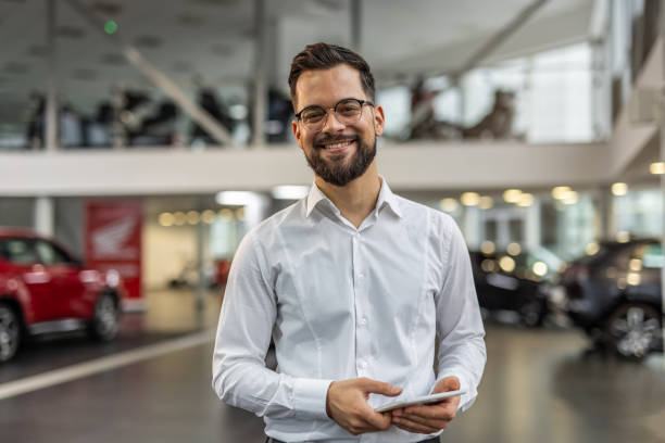 Professional advisor in a modern car showroom