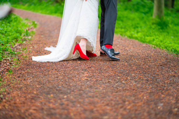 istock A Couple in Formal Wedding Attire Walking Along a Nature Path 2190244519