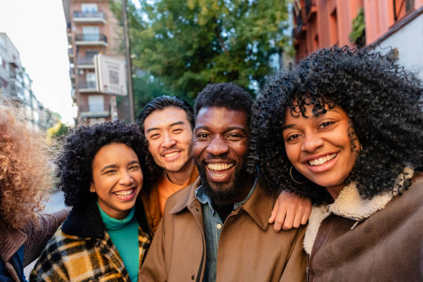 istock Happy multiethnic students smiling together on city street 2190244569