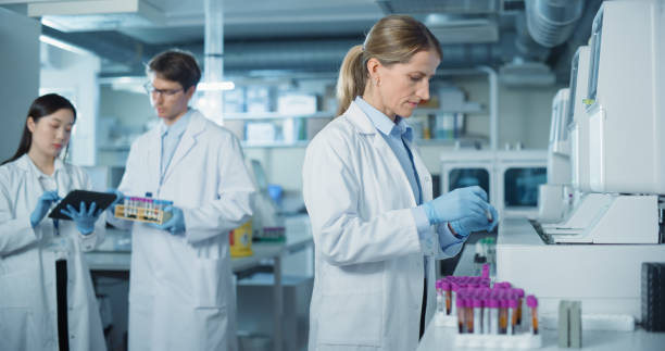 istock Diverse Team Working in a Clinical Laboratory. Biomedical Scientists Testing Out Clinical Specimens to Obtain Information About Patient Health to Aid in Diagnosis, Treatment and Prevention of Disease 2190246108