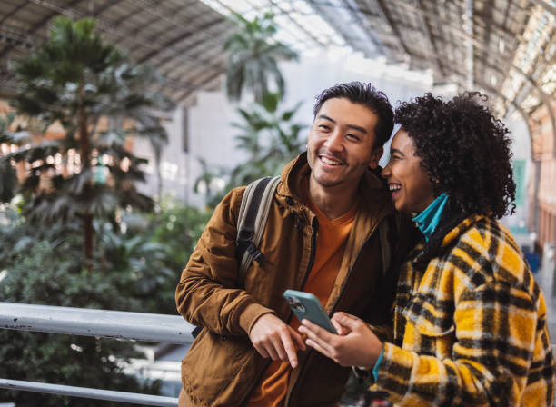 istock Friends smiling and exploring urban green space 2190246352