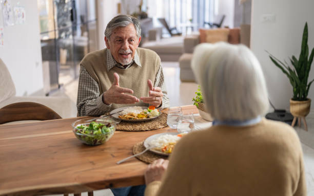 istock Elderly Couple Enjoying a Meal Together 2190246793