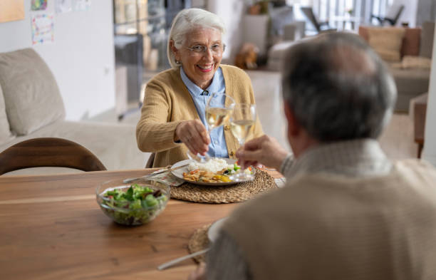 istock Elderly Couple Enjoying a Meal Together 2190246820