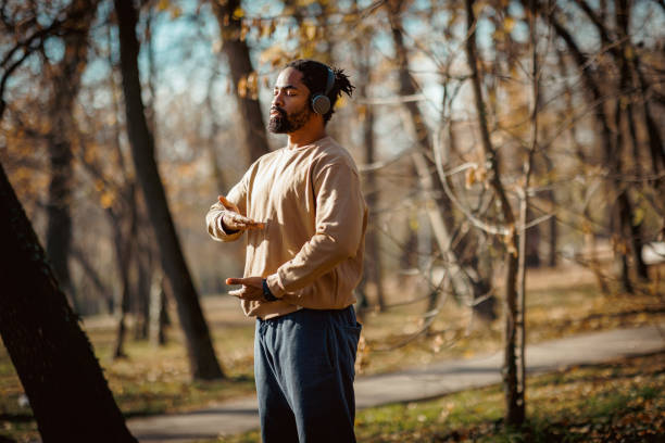 istock Young man practicing qigong in the park during autumn 2190251326