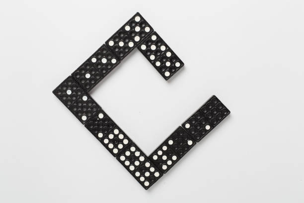 istock Black domino tiles on white background, top view 2190252581