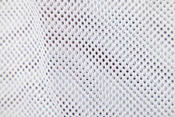 istock Texture of white-gray mesh fabric with holes. Background. 2190253082