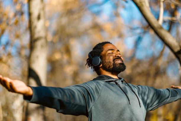 istock Man embracing nature with open arms outdoors 2190253711