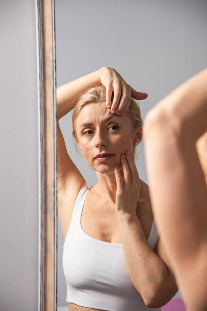 istock Beautiful woman doing facial massage in beauty studio 2190257518