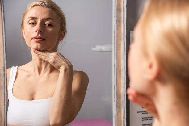 istock Beautiful woman doing facial massage in beauty studio 2190257537