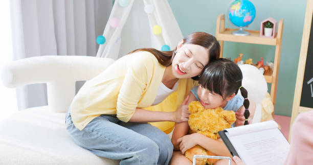 istock asian mother hugs child counseling 2190257788