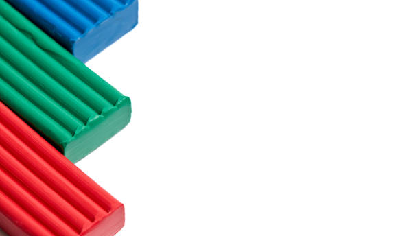 istock Artistic plastic clay for modeling in a box with copyspace mock up for 16x9 poster design.. Children red green blue RGB plasticine modeled for learning craft. Art of modeling material close up. 2190261266
