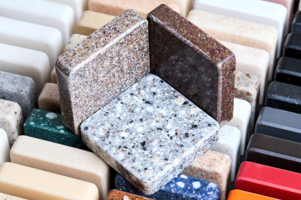 istock Porcelain stoneware artificial stone square samples as kitchen countertop examples of future kitchen fasade exterior. Samples slabs of natural granite marble quartz for stone countertops close up. 2190261750