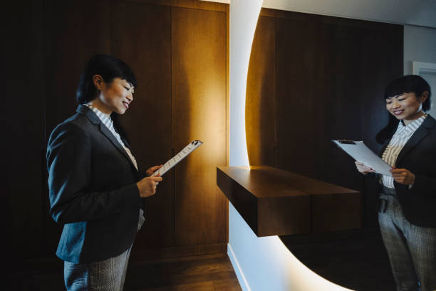istock One woman rehearsing a speech in mirror at home 2190263841