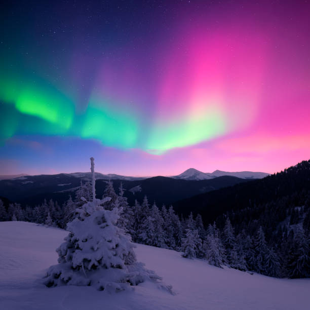 istock Fairy Northern lights in winter mountains 2190263895