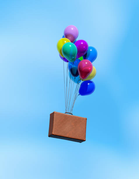 An unrecognizable decorator and event planner uses an air pump to inflate balloons and create the perfect birthday decoration