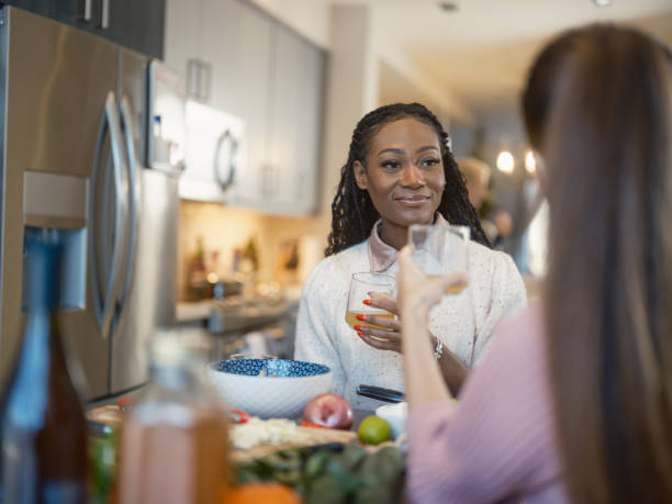istock Two Young Multiracial female friends preparing plant based meal at the kitchen 2190265805