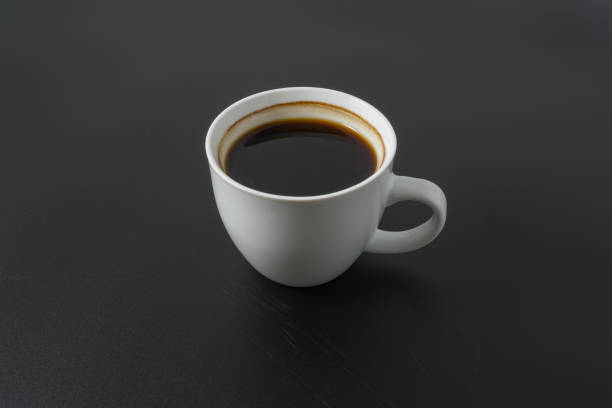 istock A cup of americano coffee on black background 2190267410