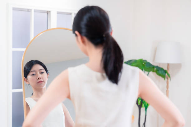 istock Young women doing yoga/exercise/diet at home 2190269273