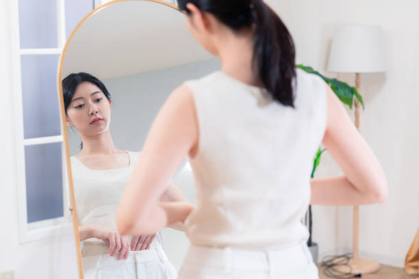 istock Young women doing yoga/exercise/diet at home 2190269276