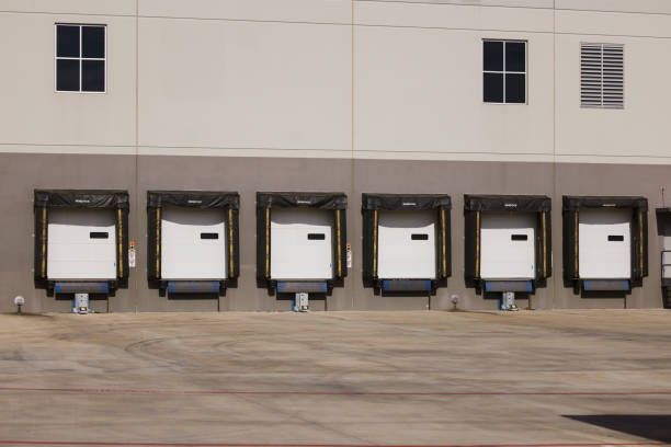 istock Industrial Loading Dock Area Showcasing Shipping Bay Doors and Warehouse Exterior 2190271731