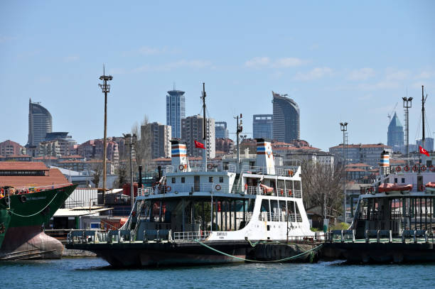 Istanbul, Turkey - April 03, 2024: Boats of different sizes in the Bosphorus Strait in Istanbul, Turkey. Bosphorus Strait is a natural strait and an internationally significant waterway