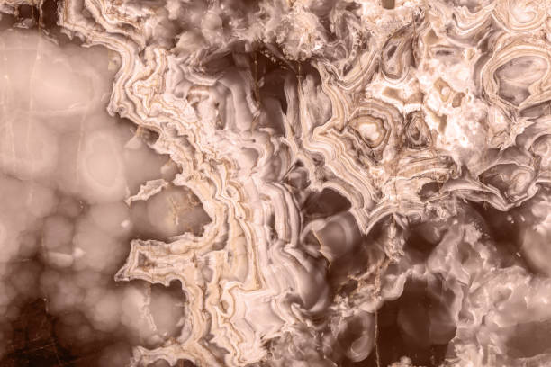 Detailed close-up of a natural stone surface, showcasing unique mocha-mousse patterns.