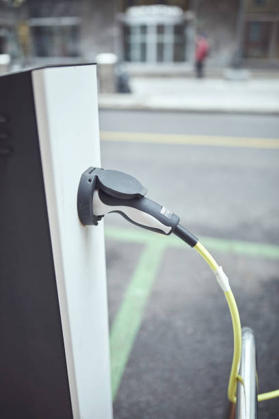 istock Charging electric vehicle on a public charger. 2190277238