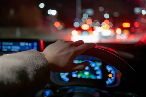 istock Hands behind the wheel of a car 2190278067