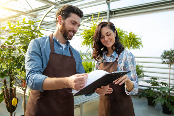 istock Greenhouse worker talking to a supervisor of quality control 2190284209