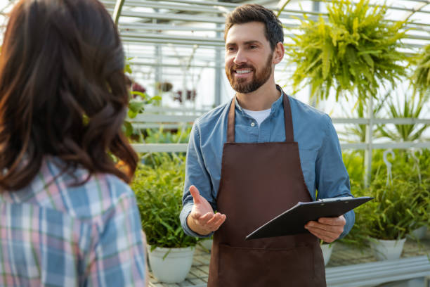 istock Greenhouse worker talking to a supervisor of quality control 2190284212