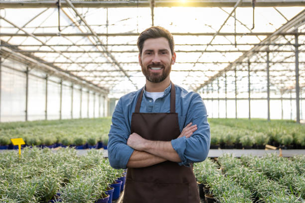 istock Positive bearded young man in a greenhouse looking determined 2190284366