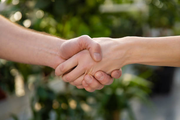 istock Close up picture of two hands in a handshake 2190284451