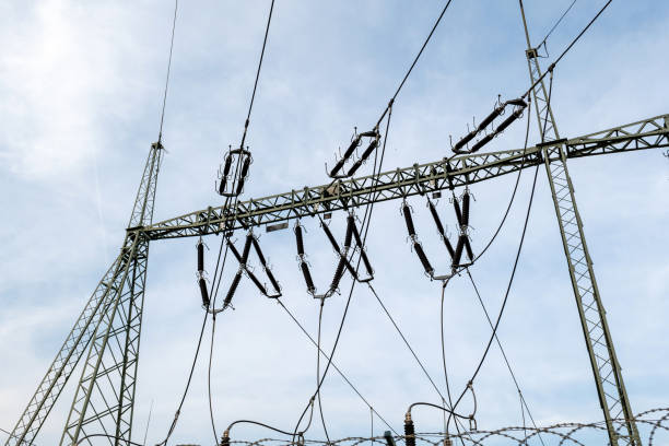 istock High voltage power station substation wires insulators under blue sky outdoors, industrial energy infrastructure with wires and cables, electricity transmission grid network elements parts concept 2190287477