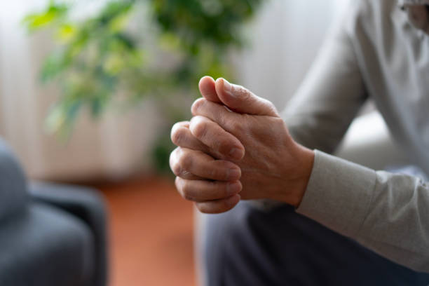 istock Senior man clasping hands showing anxiety and stress 2190287725