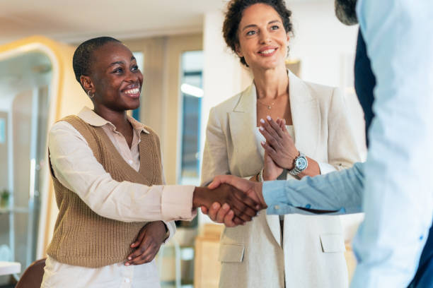 istock Business people shaking hands in the office 2190288655