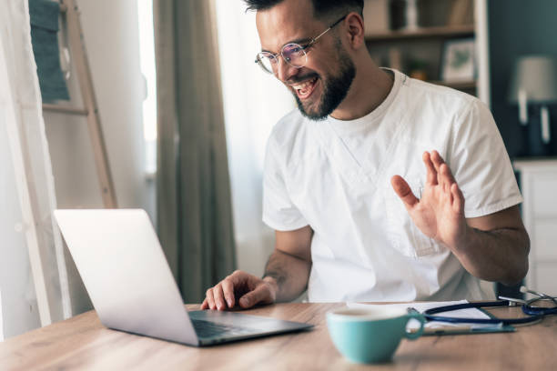 istock Doctor speaks with patient using laptop online 2190288664
