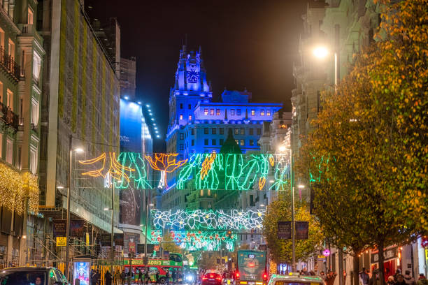 Madrid, Spain - December 11, 2024: The iconic gran via street in madrid illuminated with vibrant christmas lights and decorations, creating a magical atmosphere at night during the holiday season