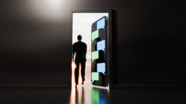 istock Man walking out an open door that is actually a large mobile phone. 2190298709