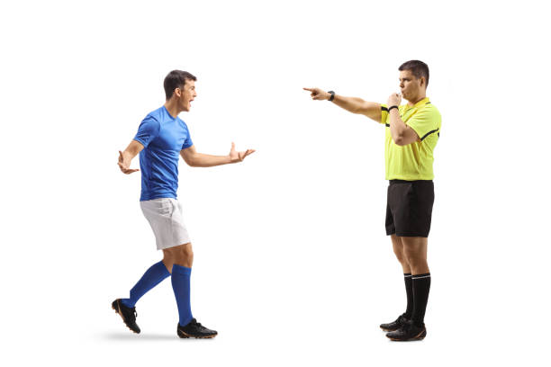 istock Football player walking towards a referee with a whistle 2190298780