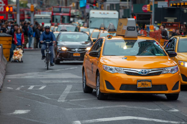 New York City - October 24, 2015: New York City Yellow Cabs along Manhattan Streets.