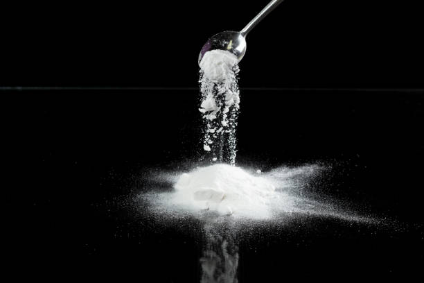 istock Tapioca starch flour fly explosion, White powder tapioca starch fall down in air. Seasoning flour powder is element material. Eyeshadow crush make up. Black background Isolated selective focus blur 2190302224