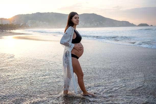 Pregnant woman enjoying the beach